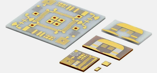 Ceramic PCB prototype with white substrate and gold traces