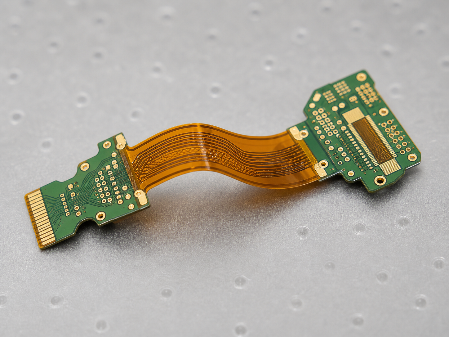 Rigid-flex PCB prototype with rigid sections and flexible interconnect