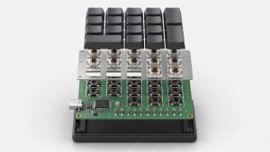 Exploded 3D view of a custom number pad PCB with mechanical switches, plate, controller, diodes and USB-C connector