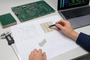 Engineer reviewing PCB fabrication drawing material notes and stackup requirements