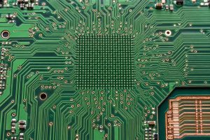 Fine-pitch BGA escape routing with microvias and nearby ground return vias on an HDI PCB