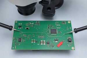 Solder bridge inspection after a multimeter continuity beep between adjacent PCB nets
