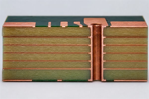 PCB cross-section showing inner copper layers, outer copper conductors and plated through-hole copper