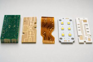 PCB material types comparison including FR-4, high-frequency laminates, polyimide and metal core