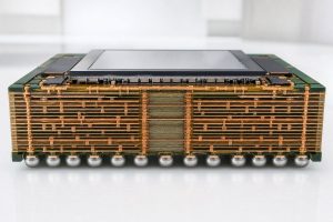 Macro cross-section of a multilayer ABF package substrate beneath an AI processor