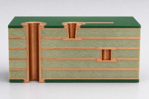 Cutaway showing through, blind and buried vias in a multilayer heavy copper PCB
