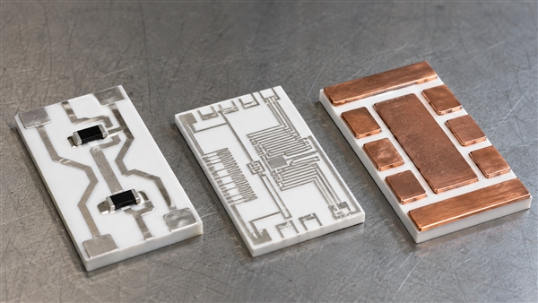 Conceptual alumina circuit samples showing printed conductors, fine thin-film patterns and bonded copper islands