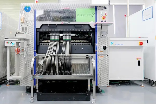Automated PCB assembly, component placement machine with tape feeders photographed on the BestPCBS website