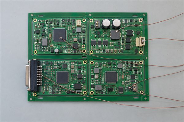 Multiple fine-wire thermocouples attached to different thermal-risk locations on a populated PCB panel