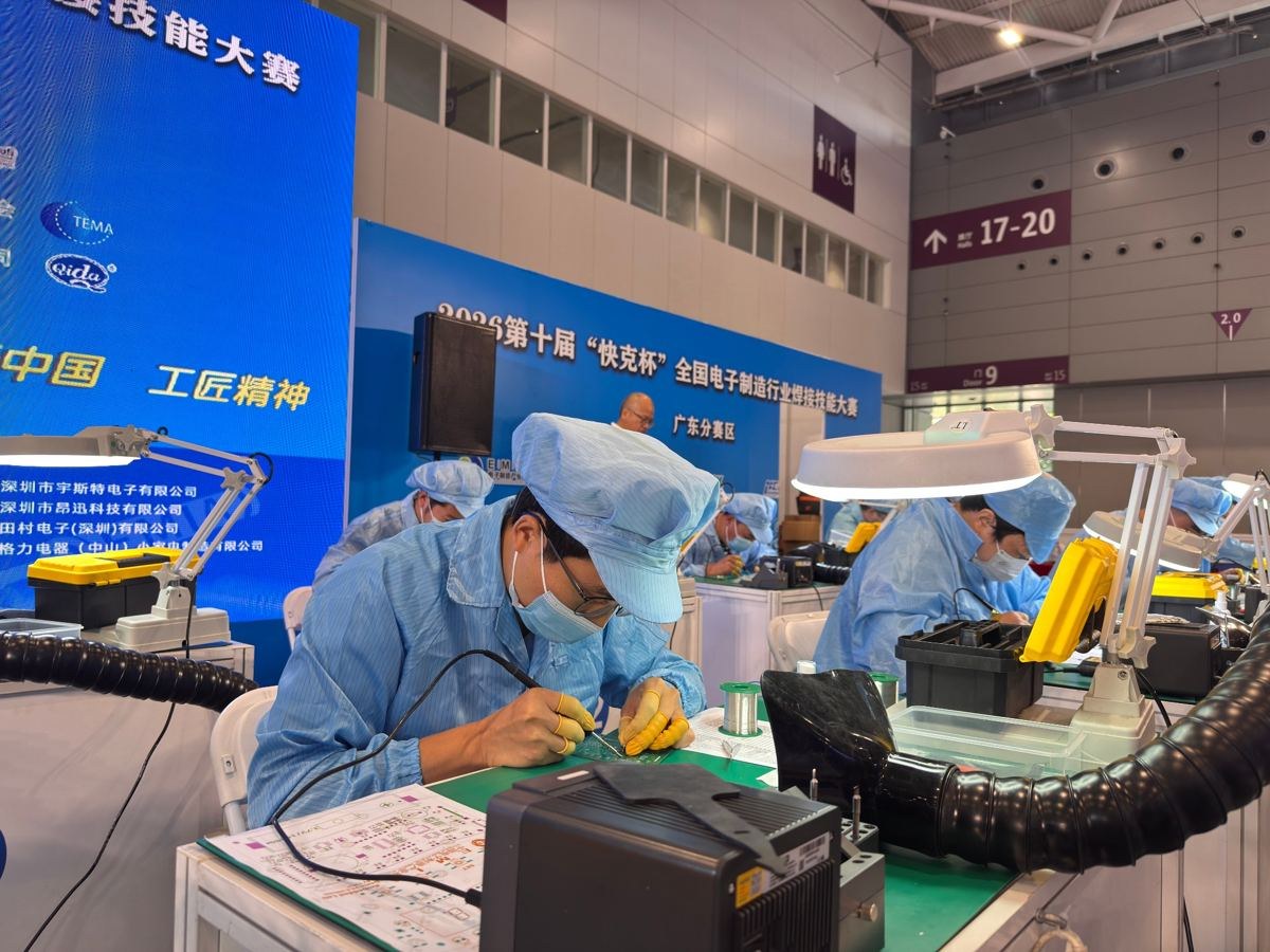 Technician performing soldering work at the QUICK Cup electronics manufacturing competition