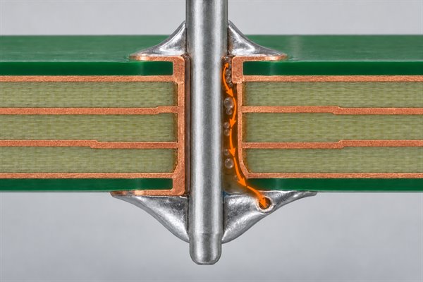 Cutaway showing gas escaping through molten solder in a plated through-hole joint